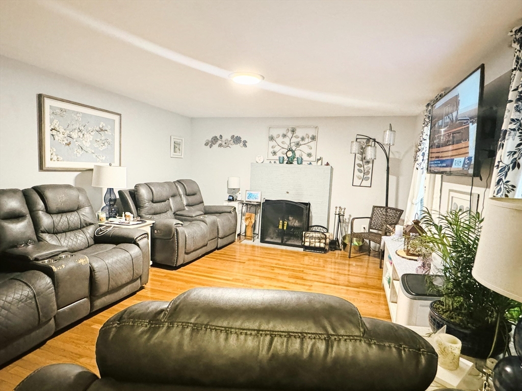 24 Bells Brook Road Lakeville, MA 02347 - Photo 8 of 15 a bed room with couch and a flat screen tv
