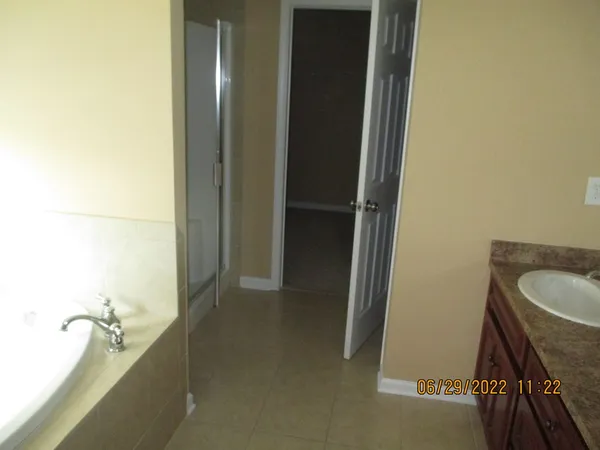 a bathroom with a tub and shower