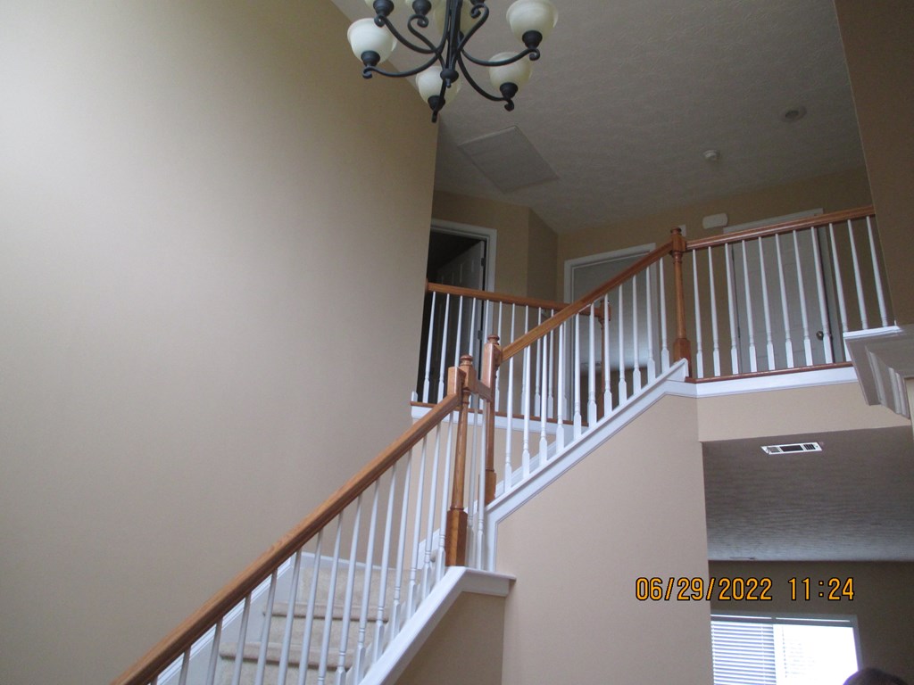 9012 Sante Fe Court Columbus, GA 31909 - Photo 3 of 16 a view of staircase with railing and white walls