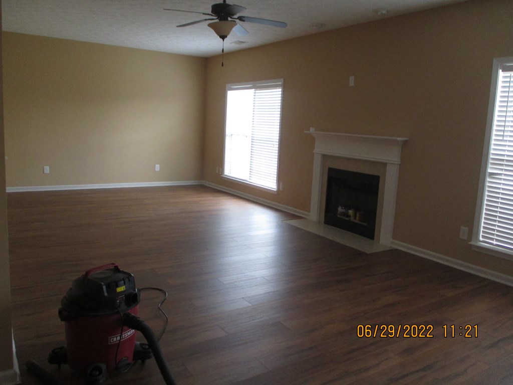 9012 Sante Fe Court Columbus, GA 31909 - Photo 6 of 16 a living room with hard wood floors and a fireplace