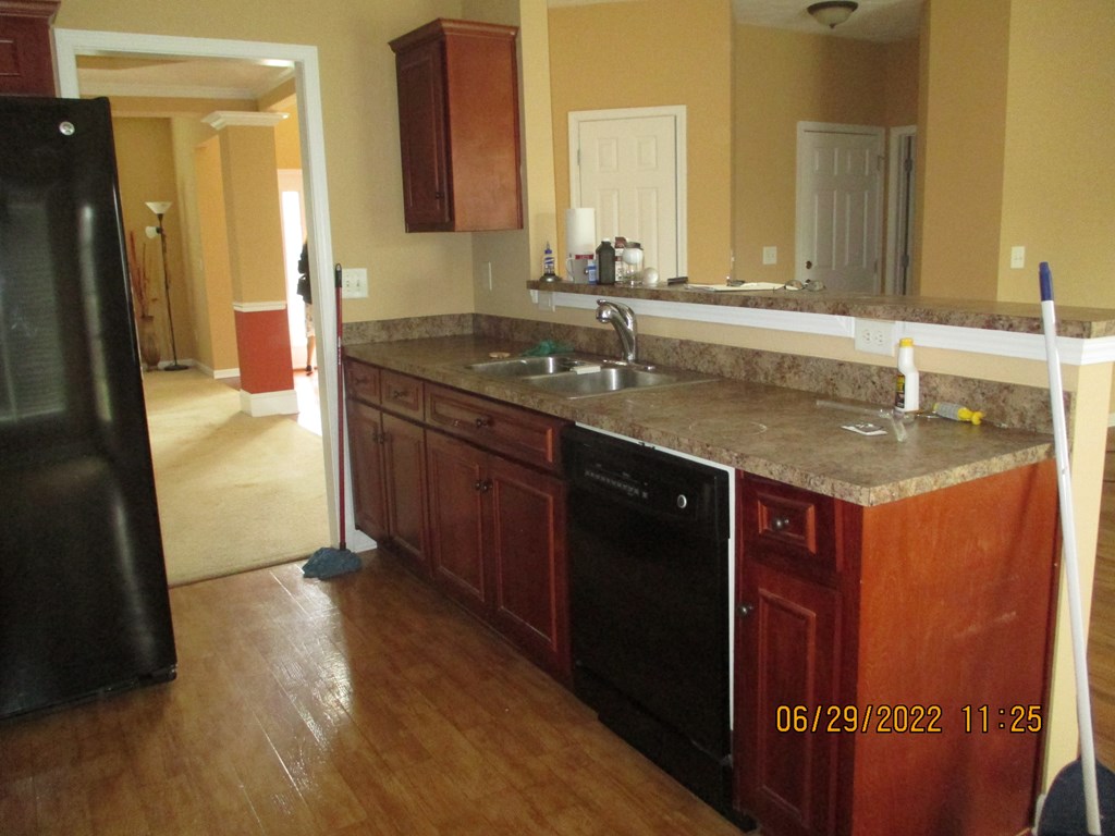 9012 Sante Fe Court Columbus, GA 31909 - Photo 8 of 16 a bathroom with a granite countertop sink a mirror and a shower