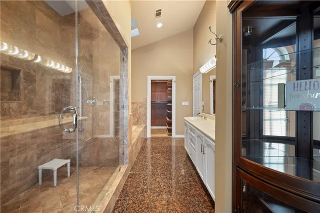a bathroom with a double vanity sink and a mirror