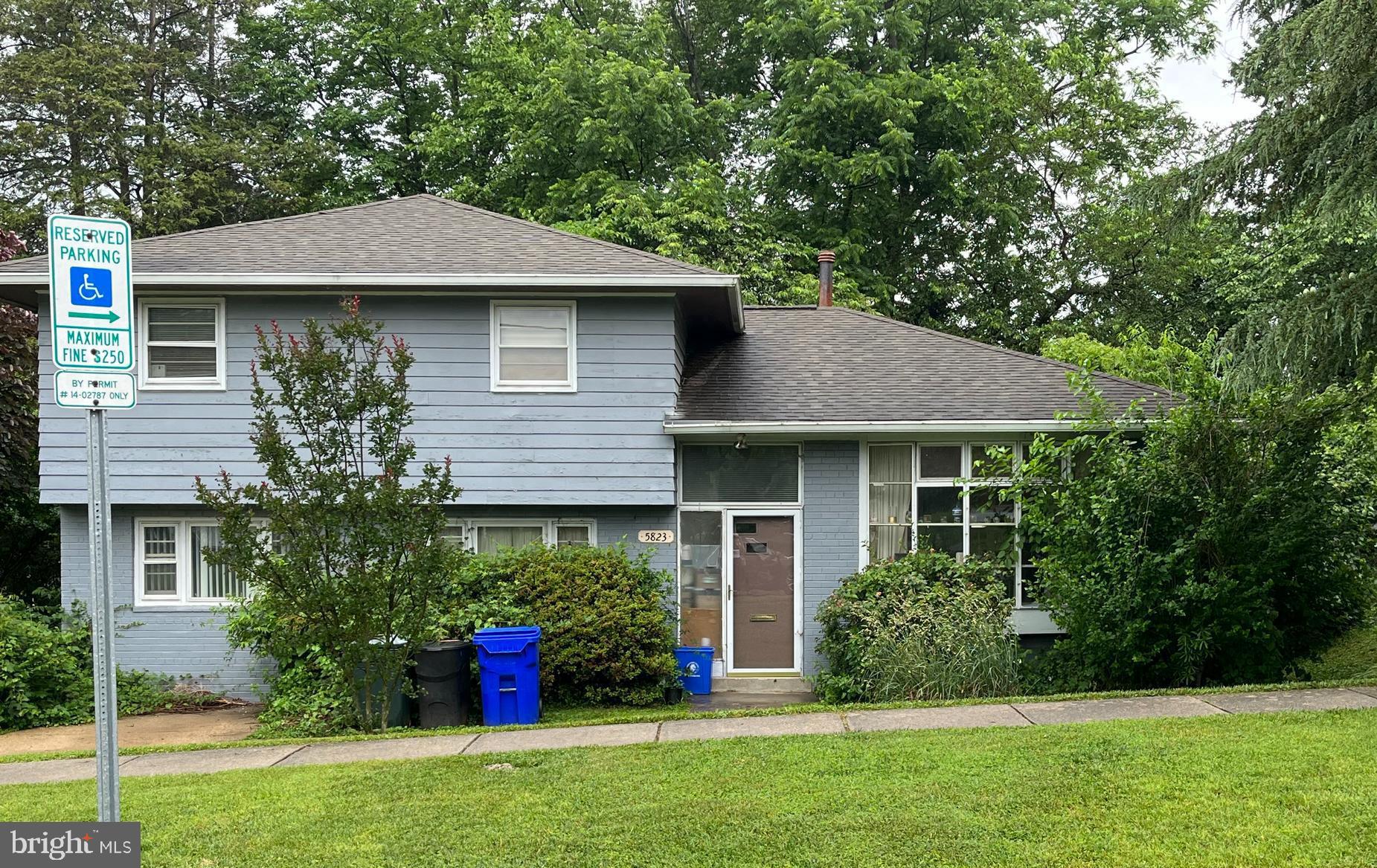 5823 Folkstone Road Bethesda, MD 20817 - Photo 1 of 3 a front view of a house with garden