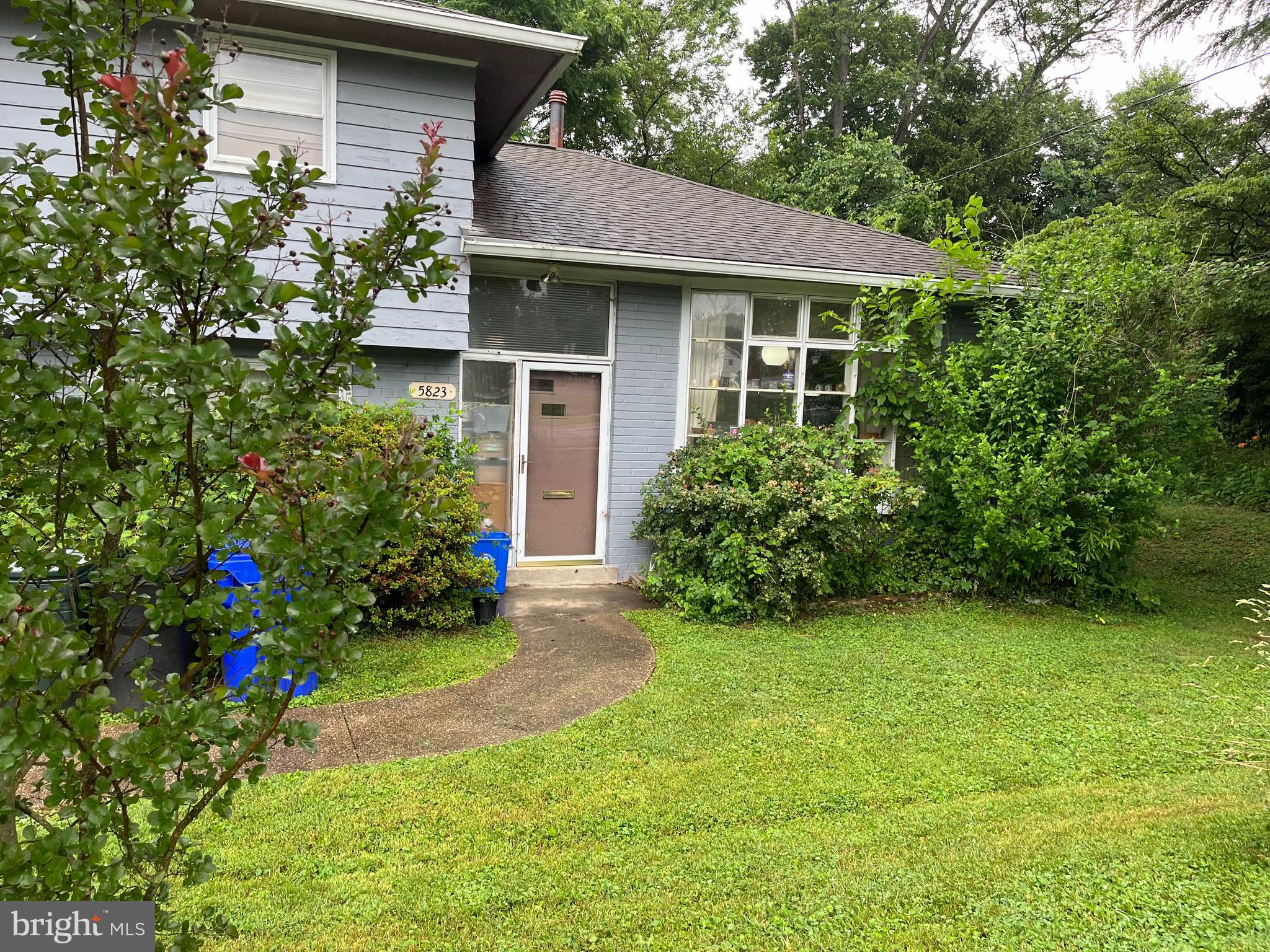 5823 Folkstone Road Bethesda, MD 20817 - Photo 2 of 3 a house view with a garden space
