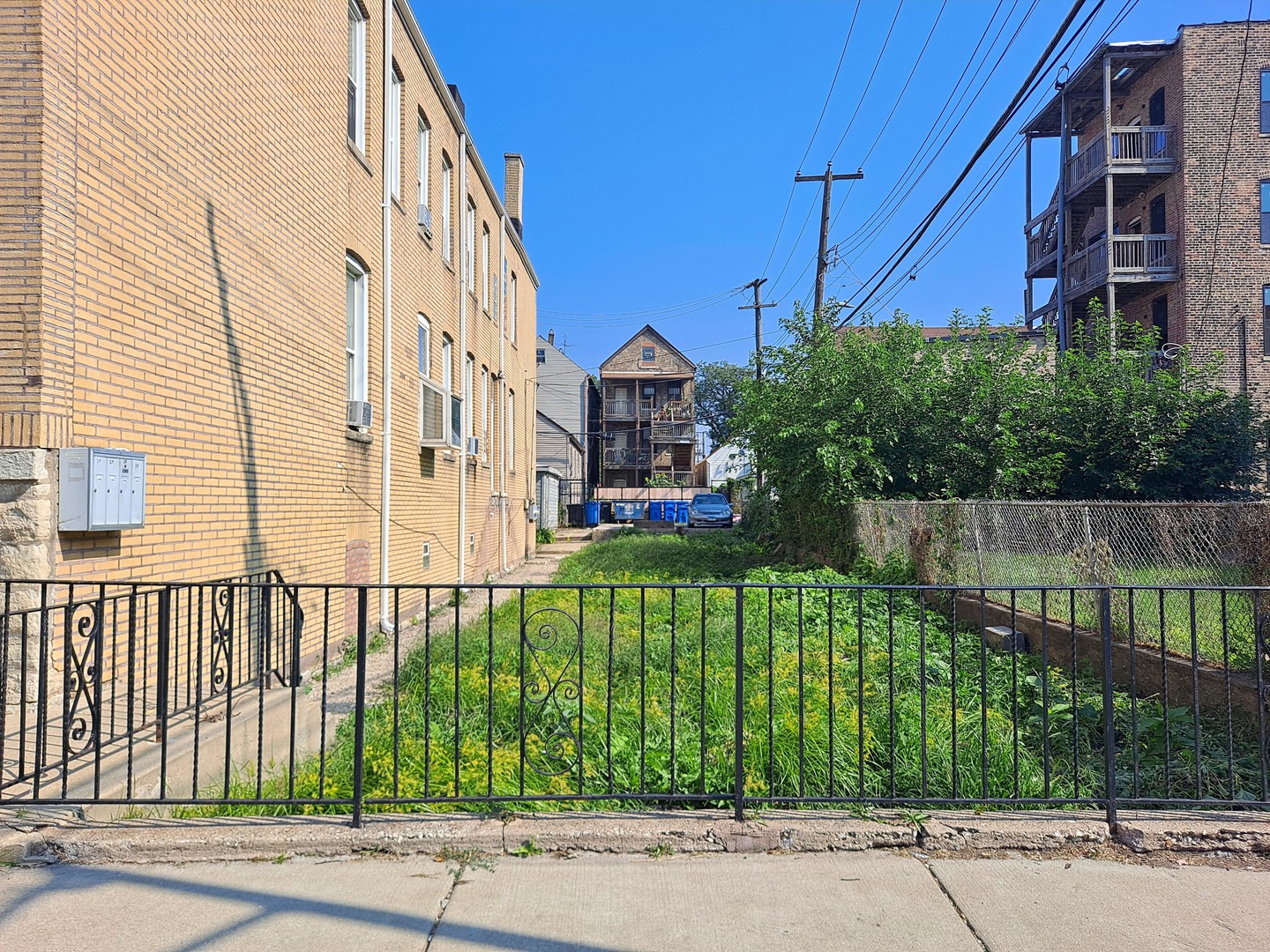a view of a brick building next to a yard