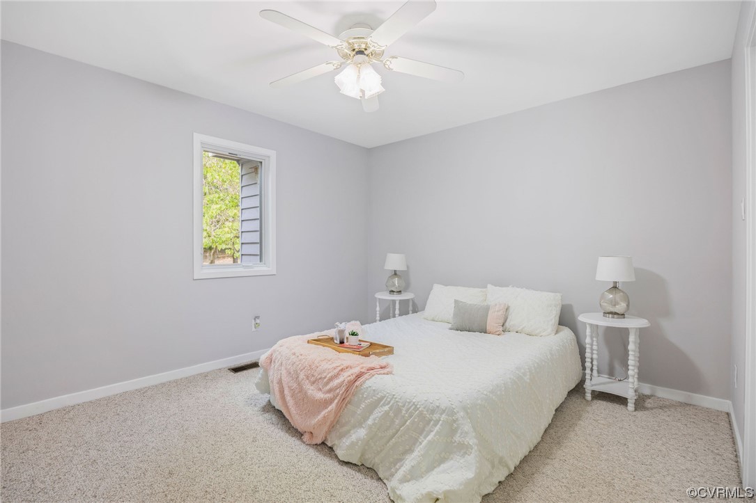 10121 North Donegal Road Midlothian, VA 23112 - Photo 27 of 48 a bedroom with a bed and a window