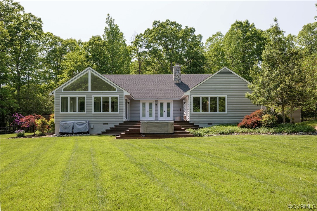 10121 North Donegal Road Midlothian, VA 23112 - Photo 36 of 48 a view of a house with a big yard and large trees