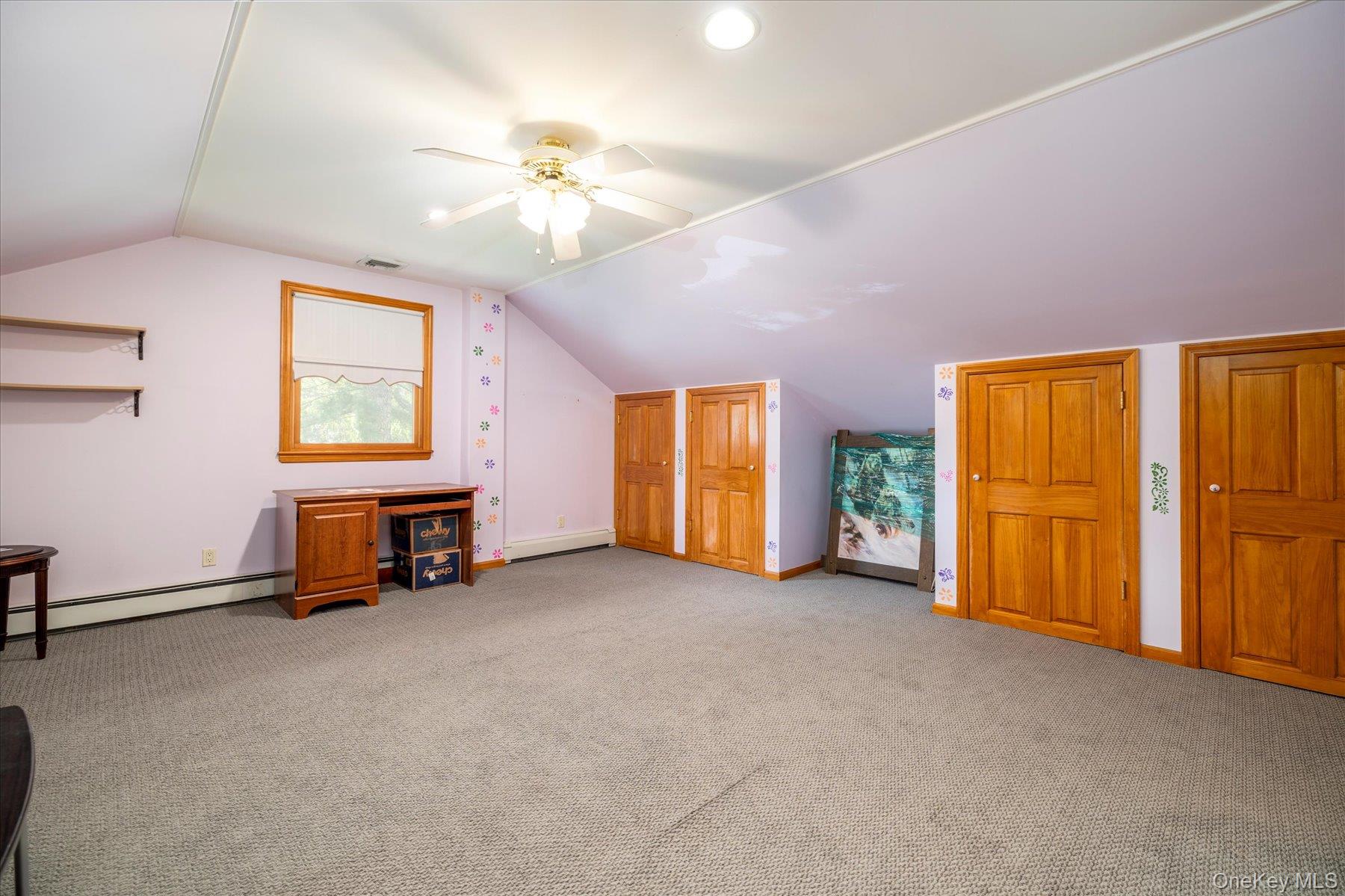 15 Baylis Road Rockville Centre, NY 11570 - Photo 13 of 20 a view of a livingroom with a furniture and chandelier fan