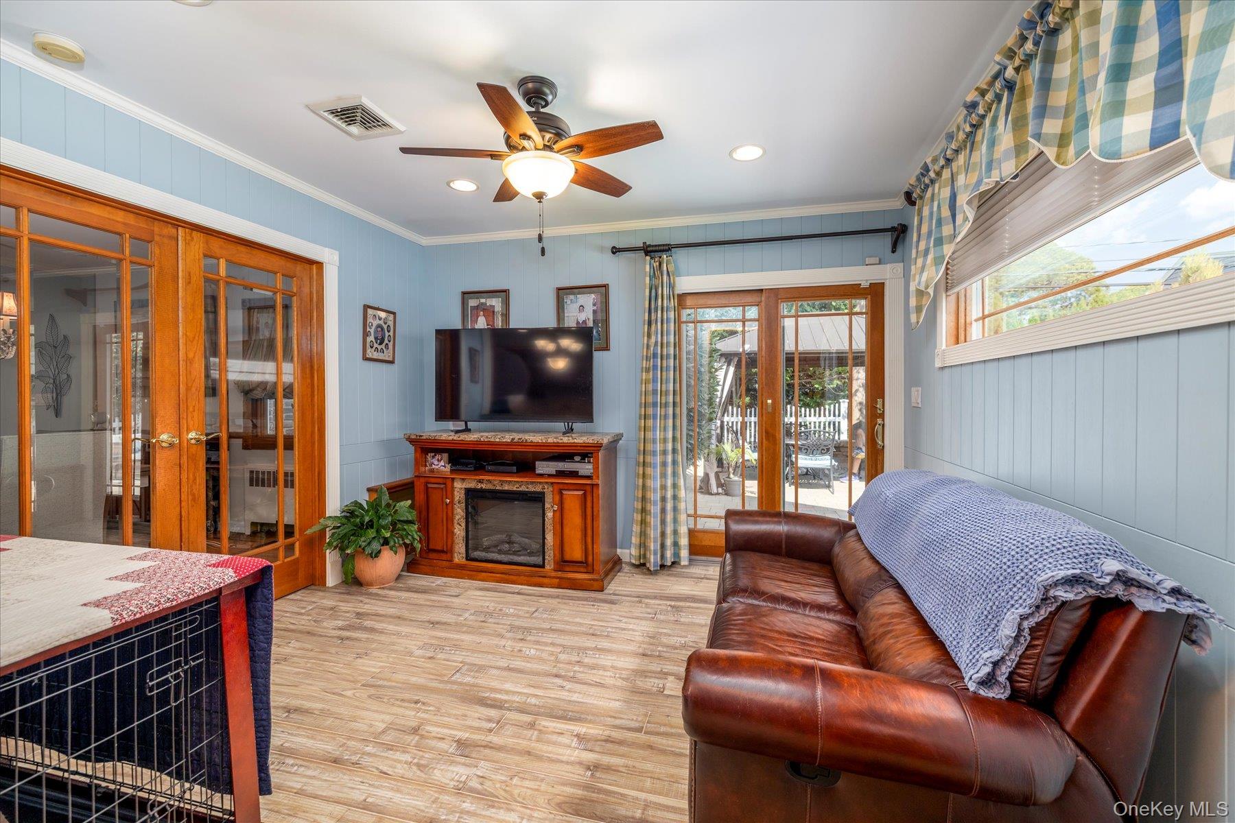 15 Baylis Road Rockville Centre, NY 11570 - Photo 5 of 20 a living room with furniture and a fireplace
