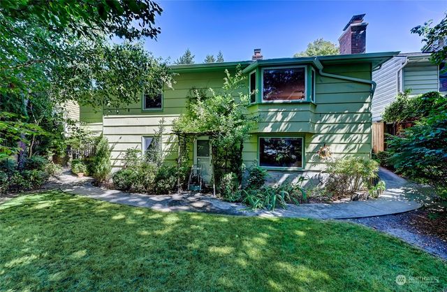 a view of a yard with large trees