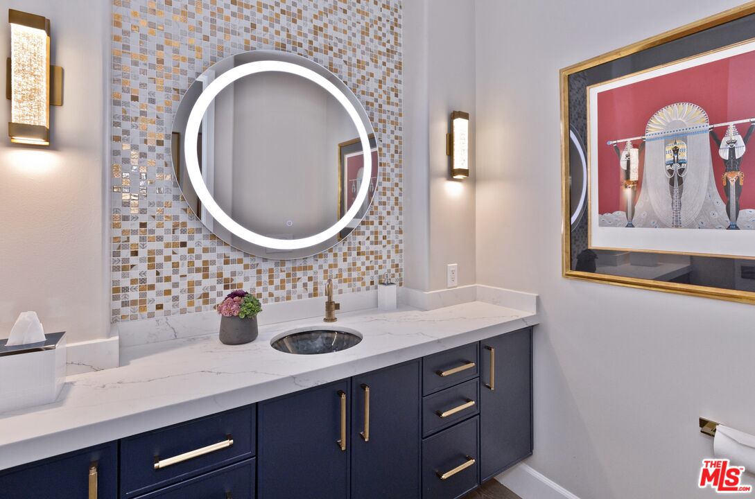 380 Loch Lomond Road Rancho Mirage, CA 92270 - Photo 11 of 39 a bathroom with a sink and a mirror