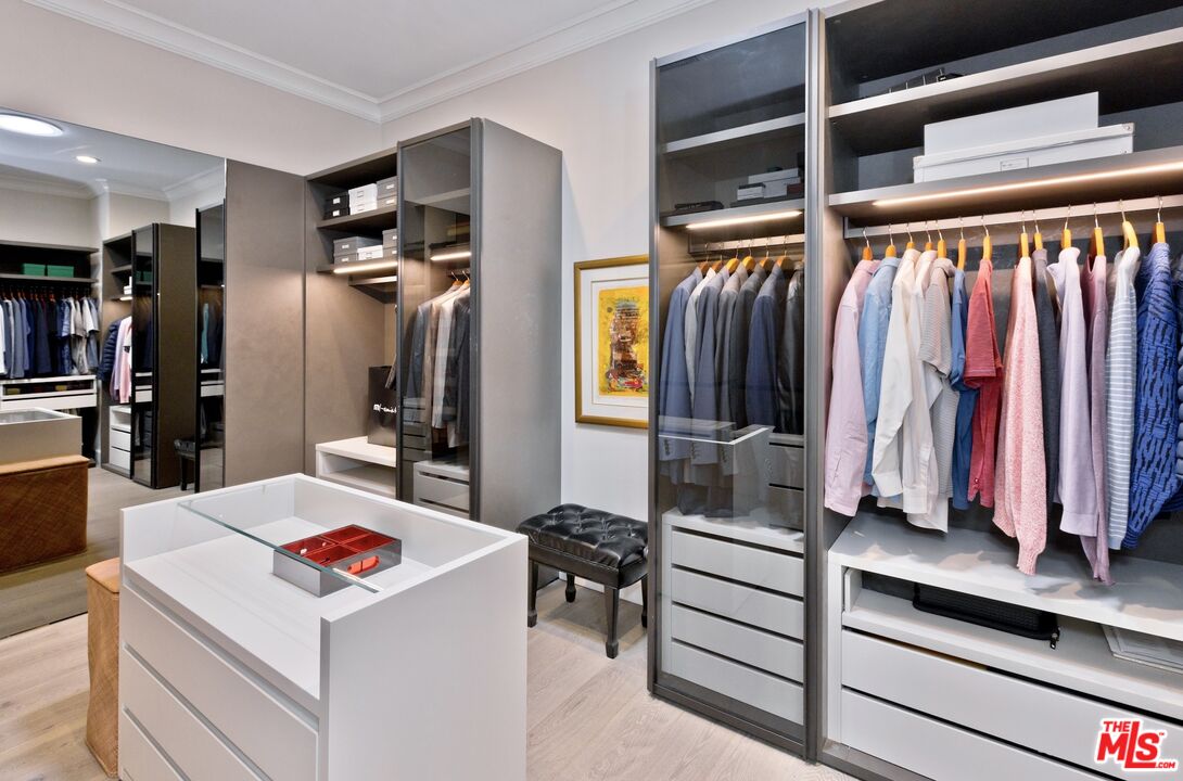 380 Loch Lomond Road Rancho Mirage, CA 92270 - Photo 19 of 39 a view of walk in closet with clothes and shoes