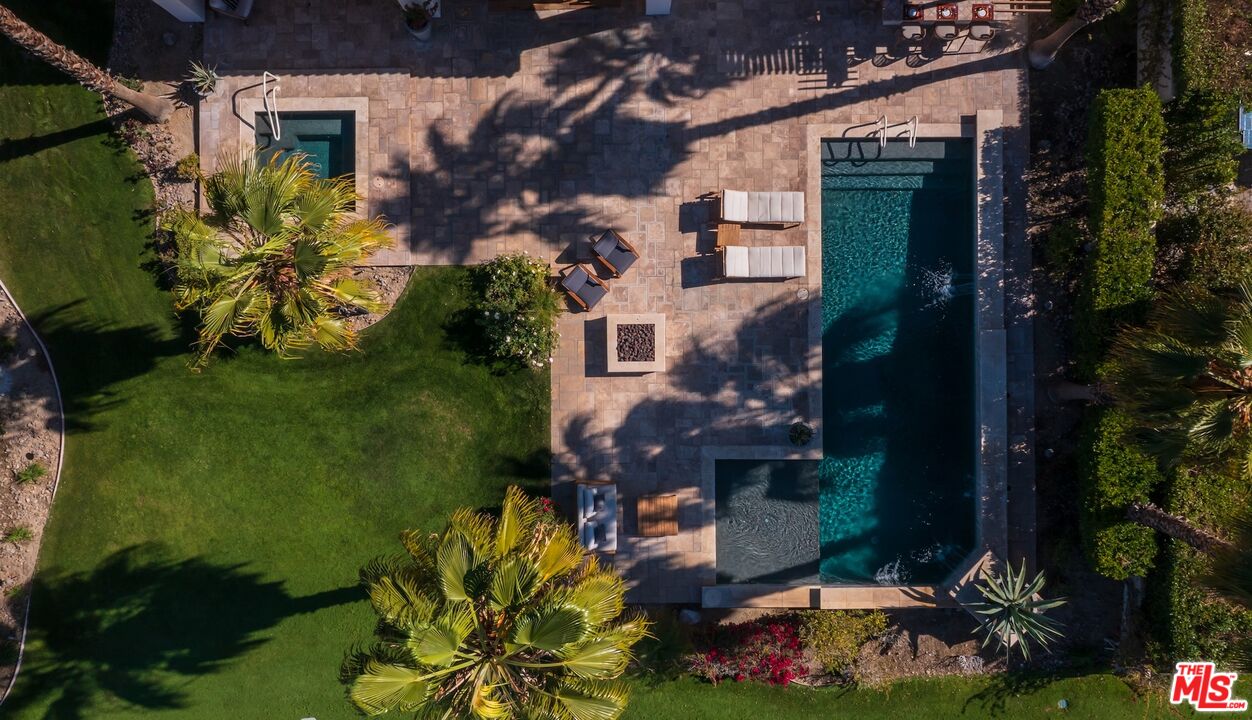 380 Loch Lomond Road Rancho Mirage, CA 92270 - Photo 27 of 39 an aerial view of a house with a yard and garden