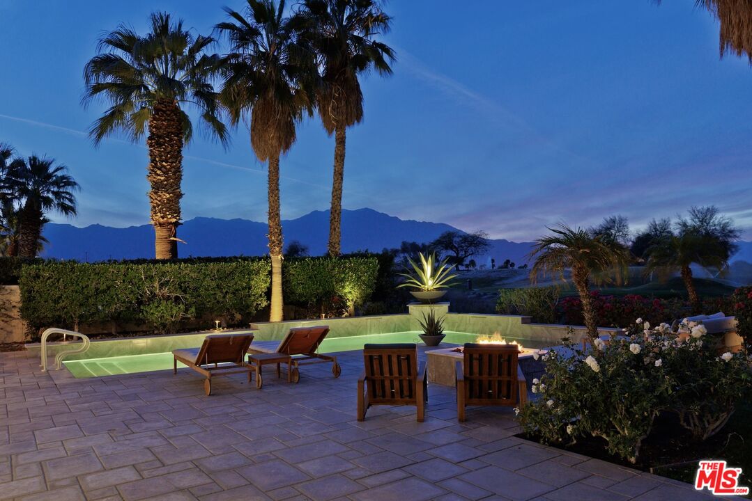 380 Loch Lomond Road Rancho Mirage, CA 92270 - Photo 28 of 39 a view of a chairs and table in patio with a fire pit