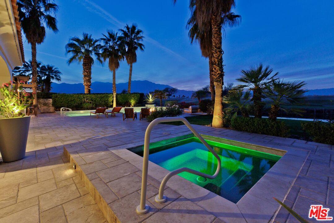 380 Loch Lomond Road Rancho Mirage, CA 92270 - Photo 30 of 39 a view of an outdoor space with a patio and swimming pool