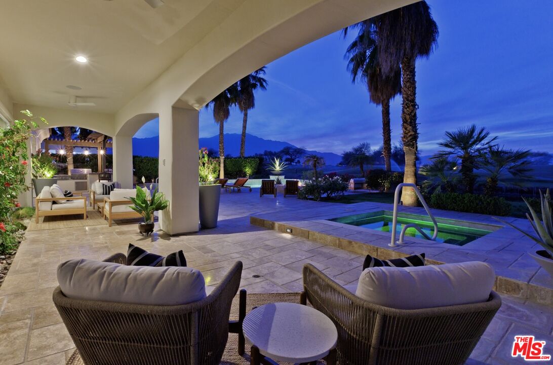 380 Loch Lomond Road Rancho Mirage, CA 92270 - Photo 3 of 39 a living room with furniture fireplace and outdoor kitchen