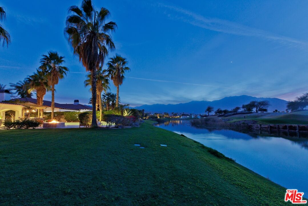 380 Loch Lomond Road Rancho Mirage, CA 92270 - Photo 35 of 39 a view of a house with a yard