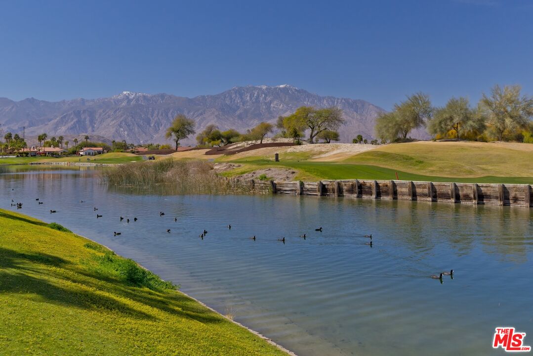 380 Loch Lomond Road Rancho Mirage, CA 92270 - Photo 36 of 39 a view of a lake with a mountain