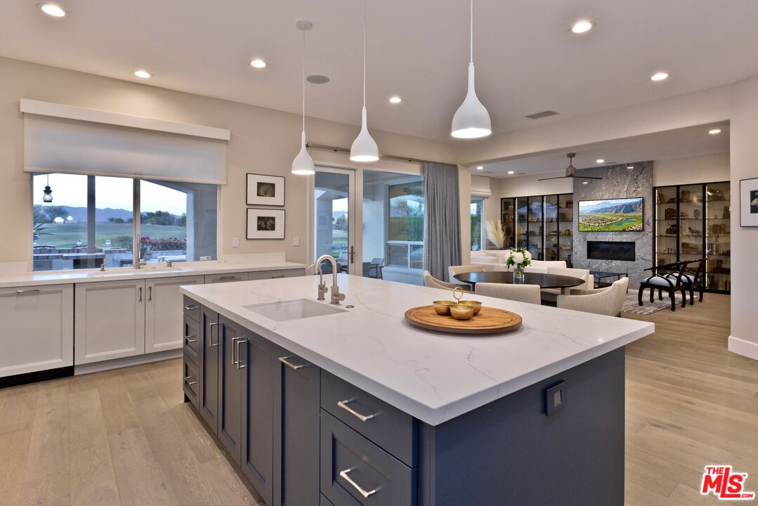 380 Loch Lomond Road Rancho Mirage, CA 92270 - Photo 4 of 39 a kitchen with stainless steel appliances a sink and stove