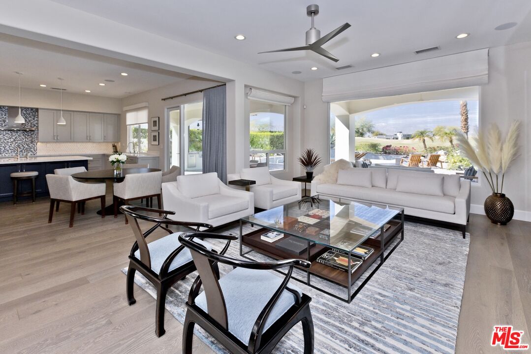 380 Loch Lomond Road Rancho Mirage, CA 92270 - Photo 5 of 39 a living room with furniture and a large window