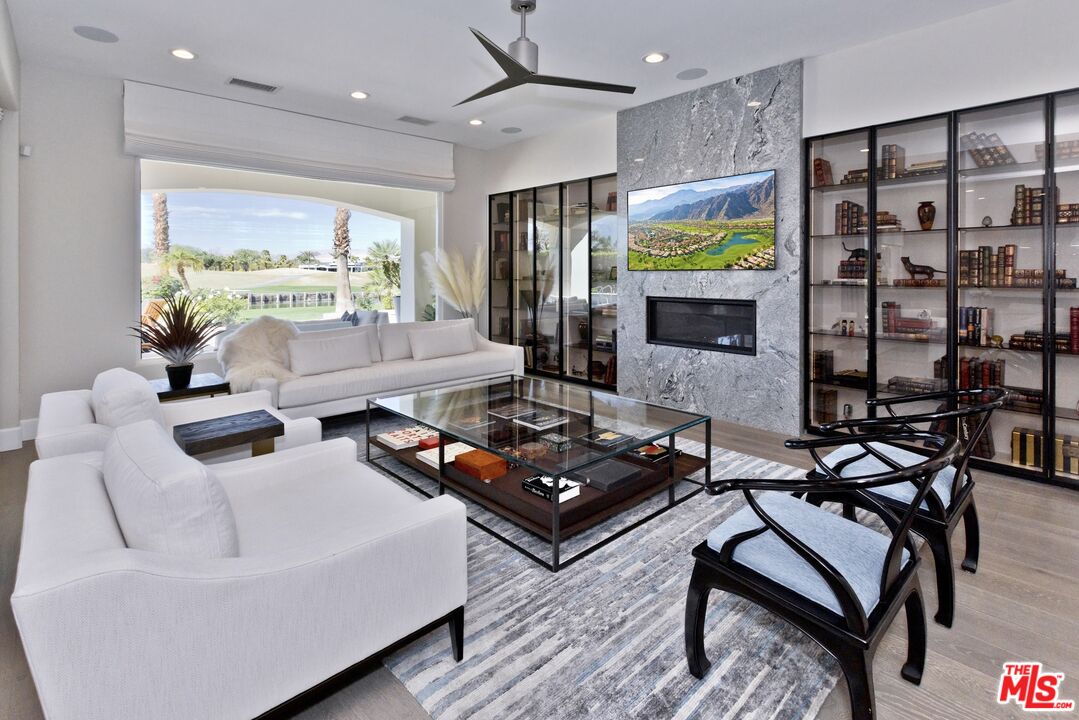 380 Loch Lomond Road Rancho Mirage, CA 92270 - Photo 6 of 39 a living room with furniture and a large window