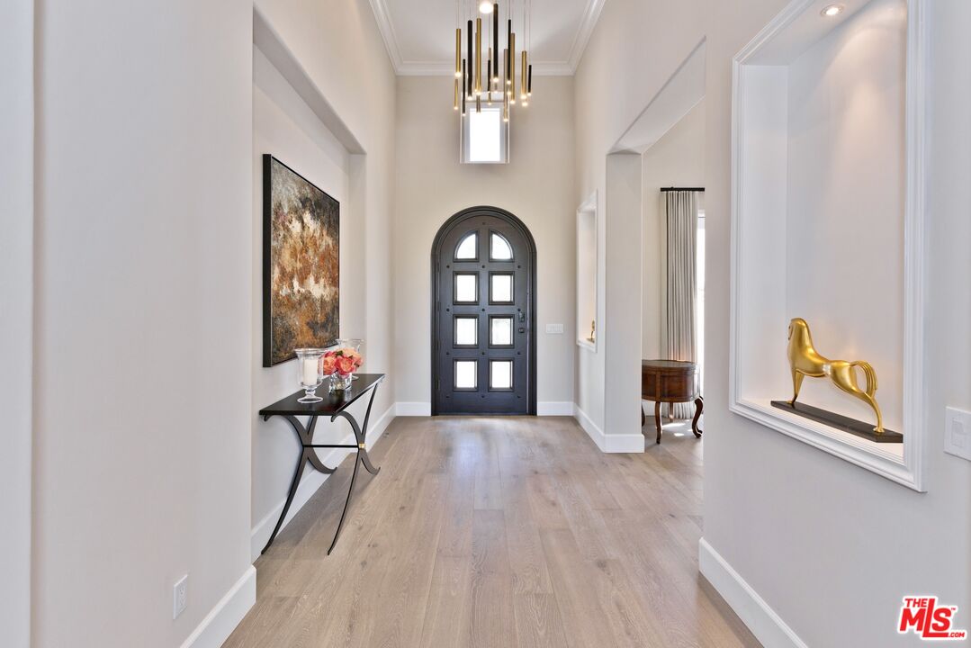 380 Loch Lomond Road Rancho Mirage, CA 92270 - Photo 8 of 39 a view of a room with window and wooden floor