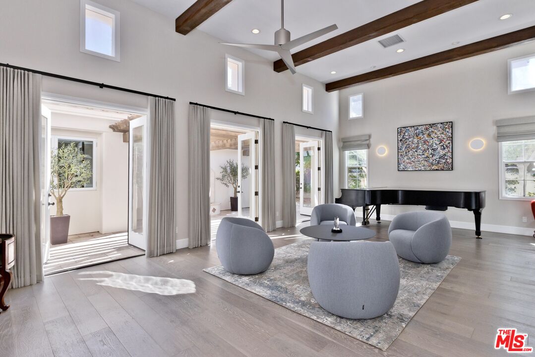 380 Loch Lomond Road Rancho Mirage, CA 92270 - Photo 10 of 39 a living room with furniture and a table