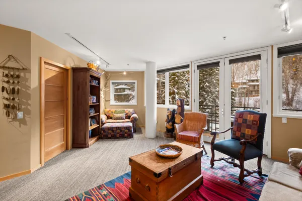 a living room with furniture fireplace and a flat screen tv
