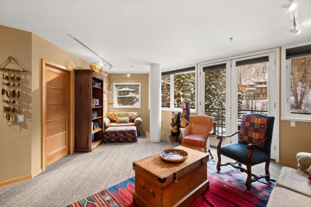 a living room with furniture fireplace and a flat screen tv