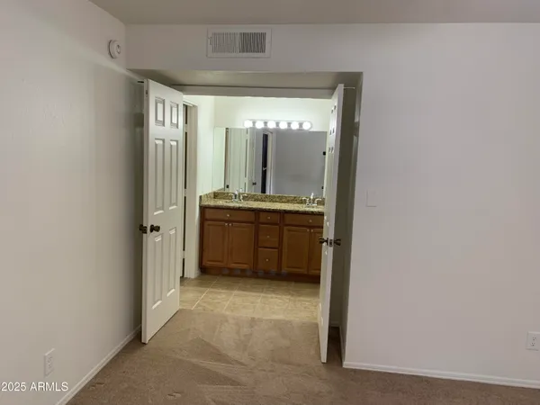 a view of a bathroom from the hallway