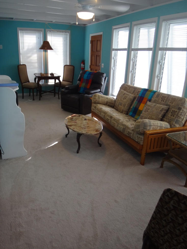 53 Barry Avenue Summerland Key, FL 33042 - Photo 13 of 22 a living room with furniture and a large window