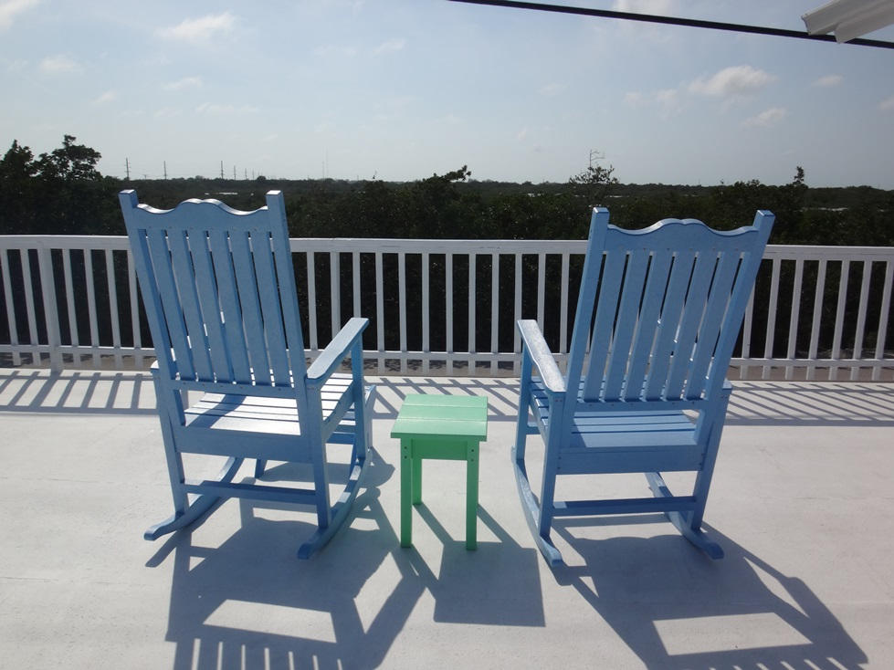 53 Barry Avenue Summerland Key, FL 33042 - Photo 3 of 22 a view of a chairs and table in the balcony