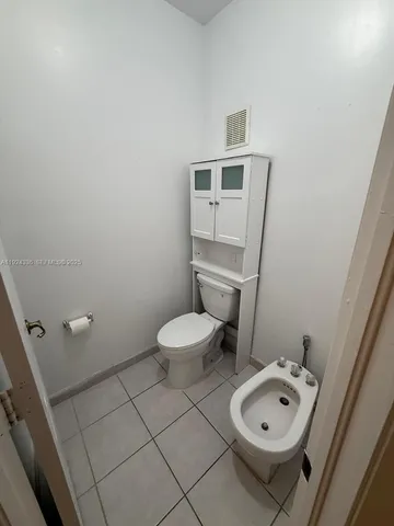 a view of room with wooden floor