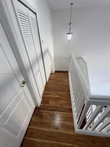 a view of balcony with wooden floor