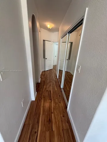 a bathroom with a bathtub sink and vanity