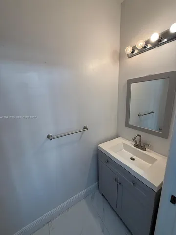 an empty room with a empty space and windows