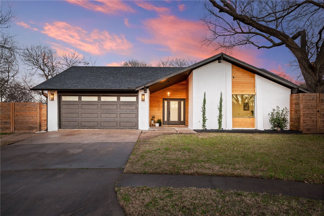 2600 Blue Cove Austin, TX 78745 - Photo 1 of 1 a front view of a house with a garden