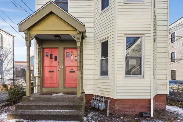 a view of a house with a door and balcony