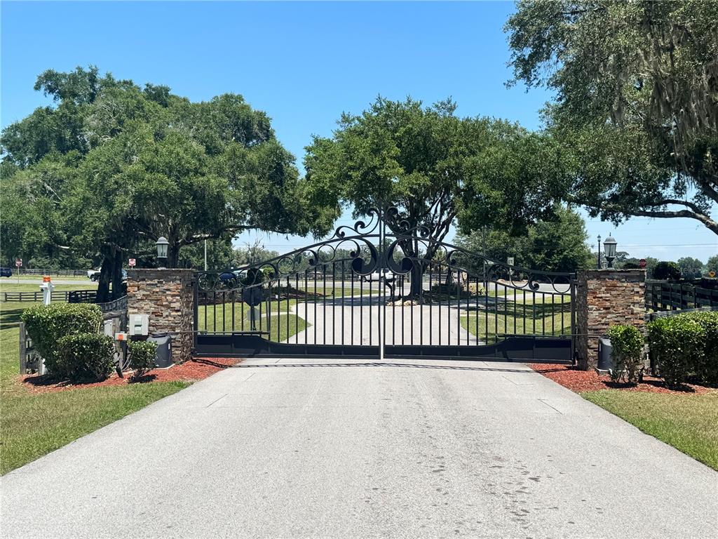 11145 Northwest 17th Court Road Ocala, FL 34475 - Photo 58 of 59 a view of a fence and a trees in the background