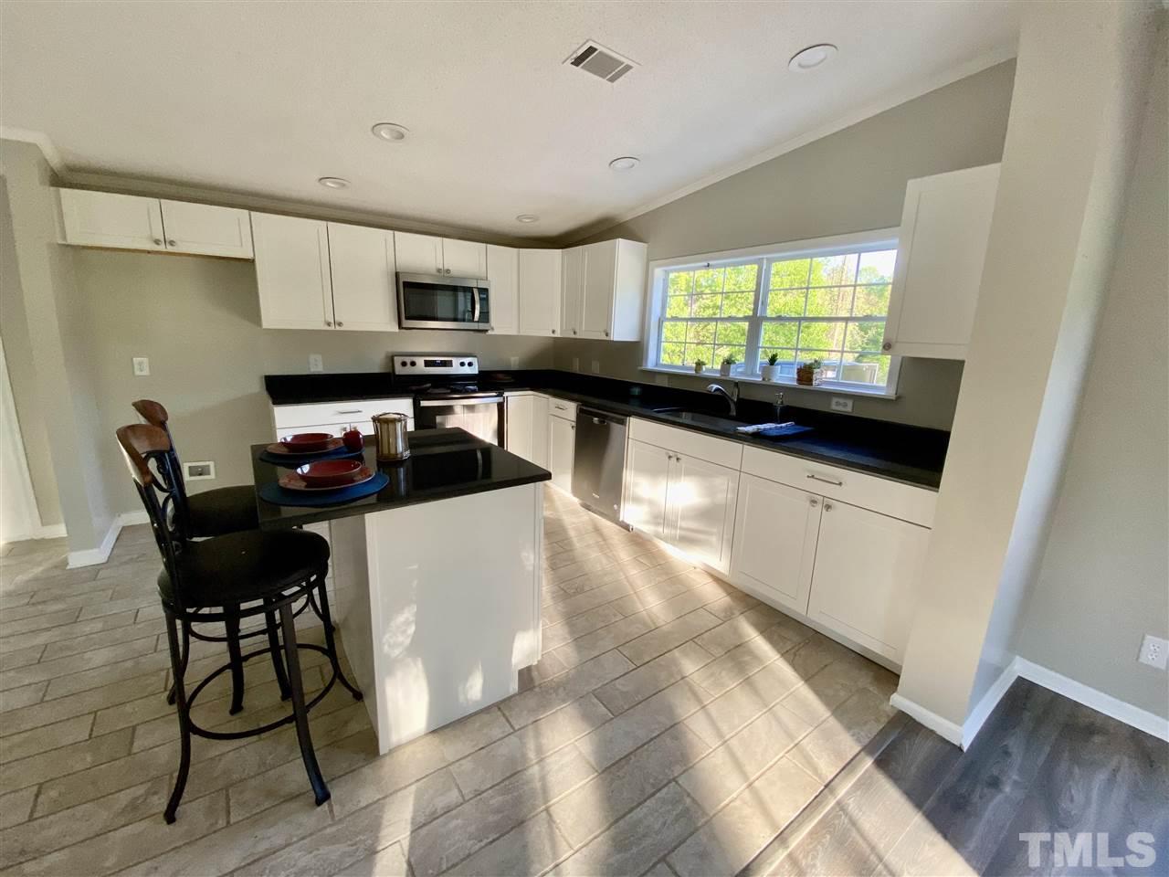 418 Balance Rock Road Kittrell, NC 27544 - Photo 14 of 28 New appliances, granite countertops, new cabinets - this kitchen is perfection!