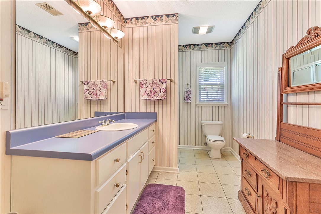 910 Chantilly Lane Anderson, SC 29625 - Photo 16 of 38 Functional bathroom offering a large vanity and a bright window, ensuring a refreshing start to your day.