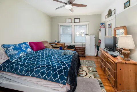 a bedroom with a bed and dresser