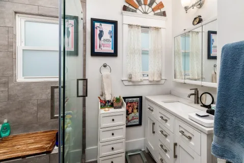 a bathroom with a sink and a mirror