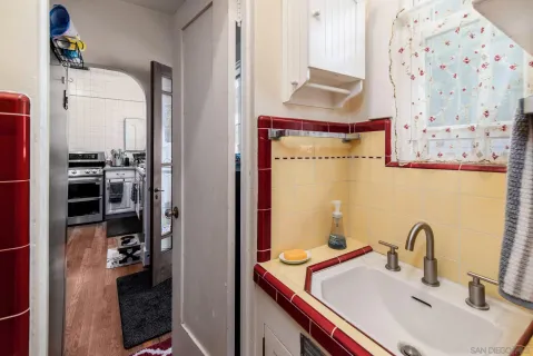 a bathroom with a sink and a mirror