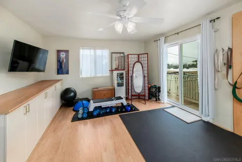 a very nice looking living room with a large window and a flat screen tv
