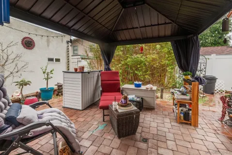 a building outdoor space with patio furniture and potted plants