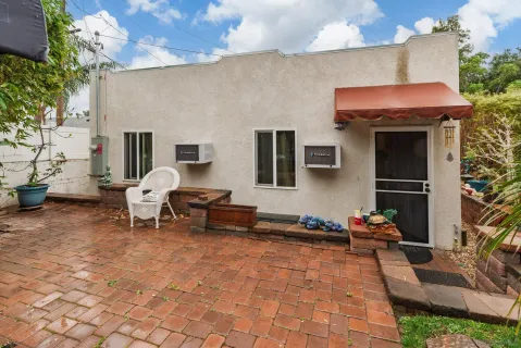a backyard of a house with seating space