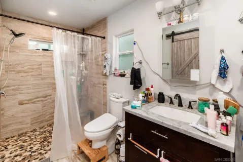 a living room with sink a washer and dryer