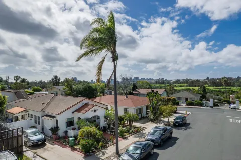an aerial view of residential houses with outdoor space