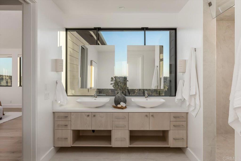 2920 Lone Jack Road Encinitas, CA 92024 - Photo 16 of 23 a bathroom with a sink and a mirror